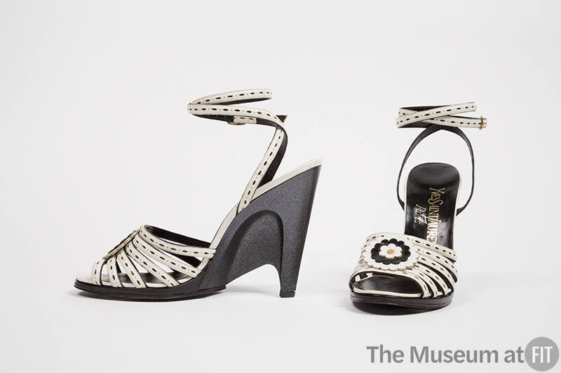 White leather sandals with front black and white leather rose and sculpted black semi wedge hig…