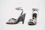 White leather sandals with front black and white leather rose and sculpted black semi wedge hig…