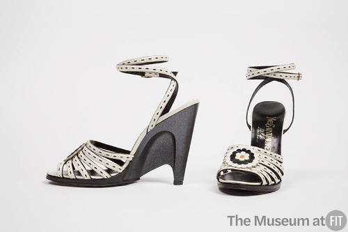 White leather sandals with front black and white leather rose and sculpted black semi wedge hig…