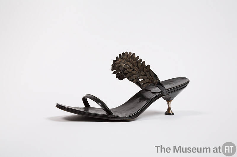 Black mule sandal with leaf spray and small waisted metal heel