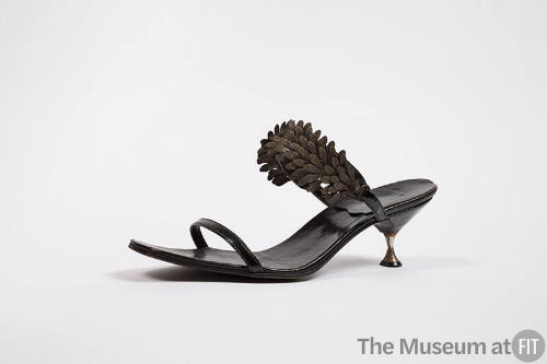 Black mule sandal with leaf spray and small waisted metal heel