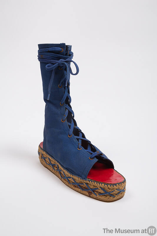Blue canvas lace up espadrille boots with raffia platform with blue cross stitches