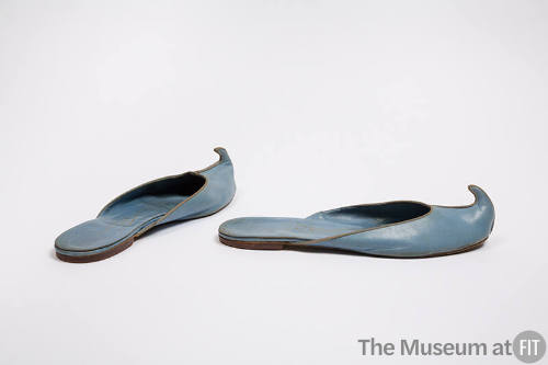 Light blue leather mules with curled toe and flat heel