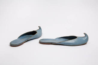 Light blue leather mules with curled toe and flat heel