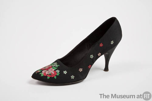 Black stiletto pumps with pink, rd, and green brocaded roes scattered throughout