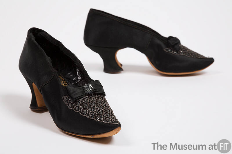 Black satin pumps with triangular geometric vamp scale design in metal seed beads and sequins 