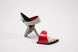 Red, black and grey sandal with sole in shape of stylized toes and faceted heel