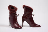 Dark red high heel boots with fur trim and ankle ties