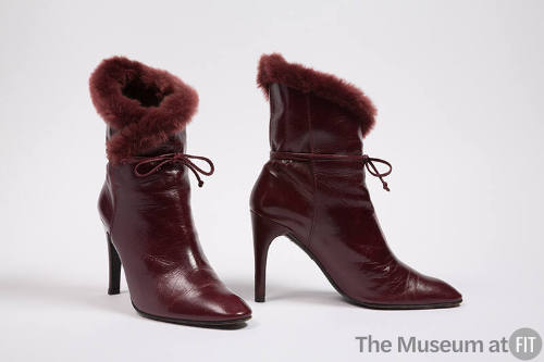 Dark red high heel boots with fur trim and ankle ties
