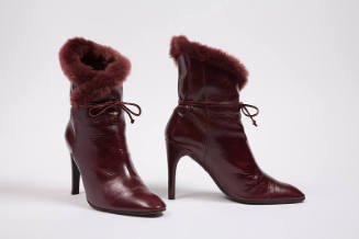 Dark red high heel boots with fur trim and ankle ties