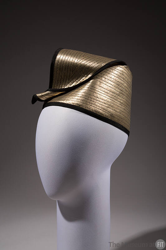 Gold lamé fez hat with black topstitching and trim