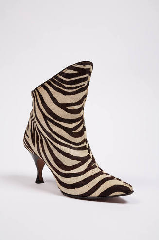Brown and white zebra printed calfskin ankle boots with curved high heel