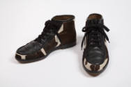 Black leather and black and white giraffe print calf hair lace up ankle boot 