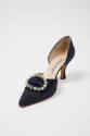 Blue silk high heel pump with cutout sides and large oval rhinestone ornament 