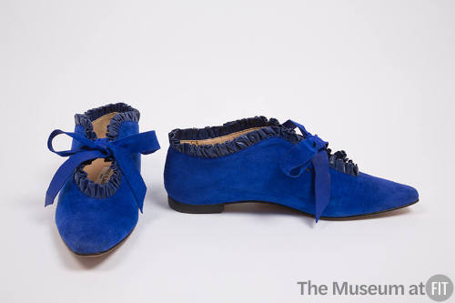 Pair of blue suede shoes with blue leather ruffled topline, keyhole throat with tie closure and…