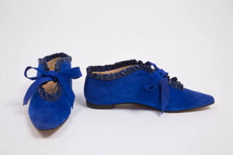 Pair of blue suede shoes with blue leather ruffled topline, keyhole throat with tie closure and…