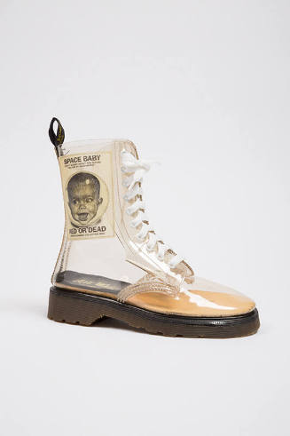 Clear plastic Dr. Martens lug sole boot with “Space Baby Red or Dead” applique on shaft, gromme…