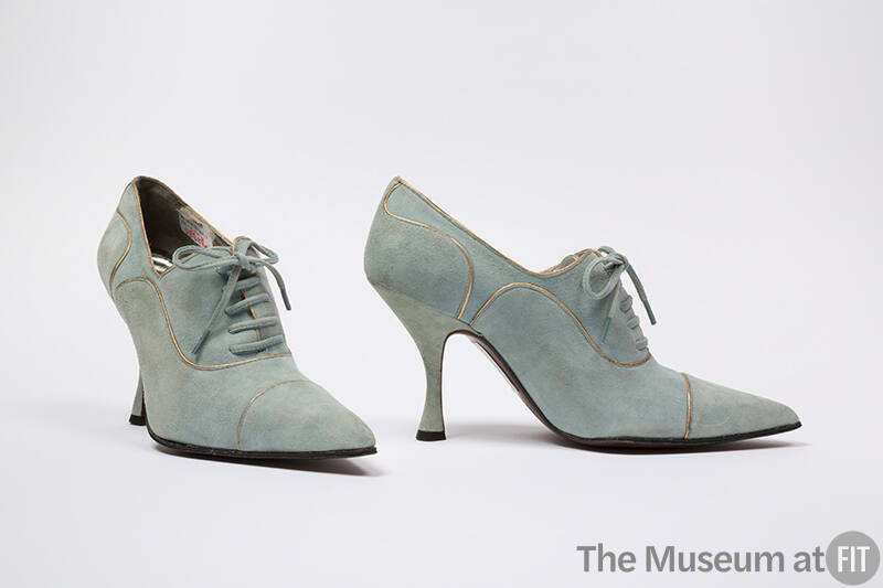 Pale blue lace up shoes with gold piping trim, pointed toe and spike heel