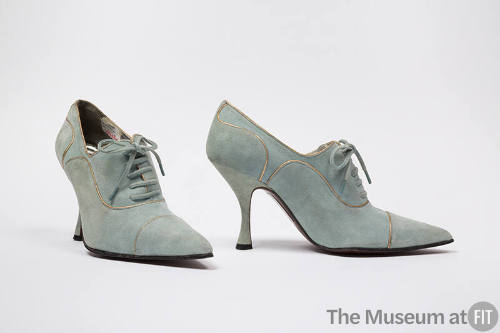 Pale blue lace up shoes with gold piping trim, pointed toe and spike heel