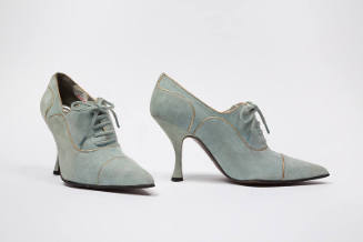 Pale blue lace up shoes with gold piping trim, pointed toe and spike heel