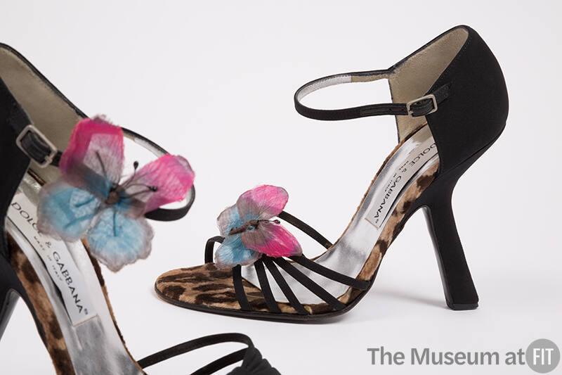 Pair of black sandals with leopard print trim, thin multistrip vamp, high angled heel and pink …