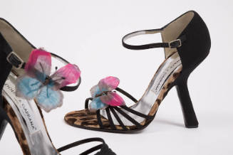 Pair of black sandals with leopard print trim, thin multistrip vamp, high angled heel and pink …