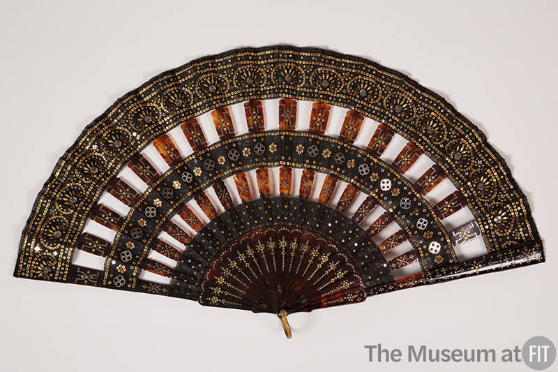 Black fan with tortoise shell sticks and all over silver and gold sequins