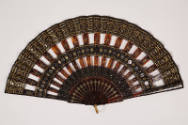 Black fan with tortoise shell sticks and all over silver and gold sequins