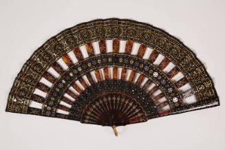 Black fan with tortoise shell sticks and all over silver and gold sequins