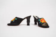 Pair of black mule sandals with large yellow and orange roses embroidered on vamp and high scul…