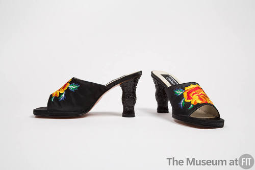 Pair of black mule sandals with large yellow and orange roses embroidered on vamp and high scul…