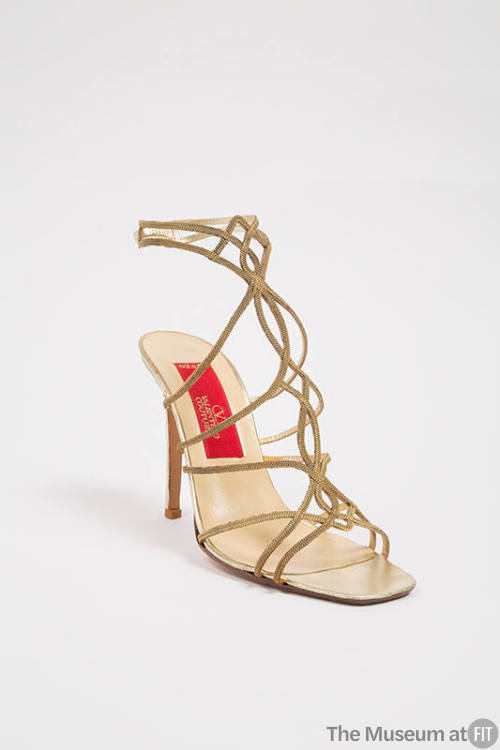 Gold stiletto heel gladiator sandal made of interlacing chains to ankle strap and red Valentino…