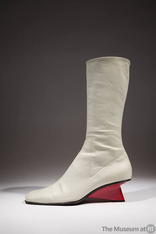 White leather mid-calf boot with red triangular heel