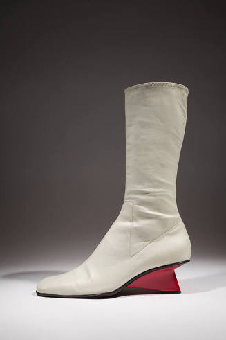 White leather mid-calf boot with red triangular heel