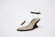 black heel and ankle strap with transparent fishing line strands for illusion of invisible sand…