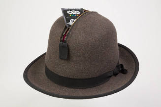 Man’s light brown charcoal wool hat with short brim, black grosgrain ribbon hat band and high c…