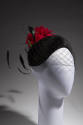 Black velvet curved skull cap with black face veil, long black feathers at back and large red r…