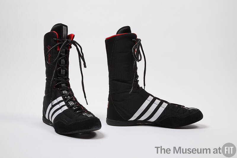 Black lace-up above-the-ankle boxing shoes with three white stripes on sides, red trim 