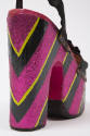 Back heel detail of black satin sandals with hand painted metallic purple, black and green stri…