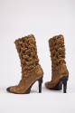 Bronze metallic mid calf high heel boots with overall puckered quilt stitch and black toe cap, …