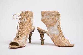 Ivory and metallic gold open toe lace up ankle boots in silk brocade with a large leaf design; …