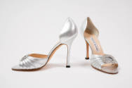 Silver metallic d'Orsay evening pumps with open toe and high heel, side pleats at front band ra…