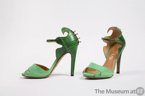 Green snakeskin high heel ankle strap sandals with swirling top edge and light green front stra…