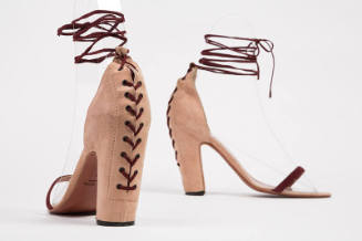 Dusty pink high heel sandals with dark red front bar strap and corset lacing at center back and…