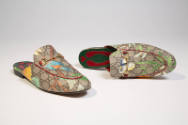 Pair of brown mule slippers with Gucci “GG” logo print and motifs of leaves, flowers and birds …