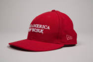 Side view of red baseball cap showing NE logo