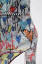 Detail view of silver ankle boot showing allover sequins with black and multicolor hearts, star…