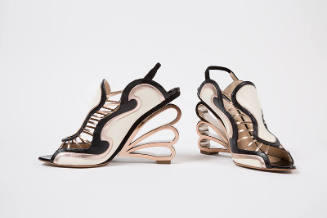 Pair of sling back sandals with off-white, black and pink gold wave design and molded gold scal…