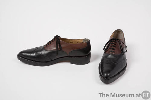 Black and brown leather wingtip lace up shoes 