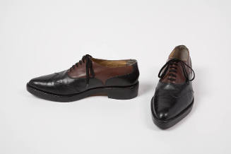 Black and brown leather wingtip lace up shoes 